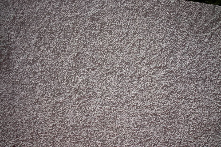 New plasterboard stud wall dividing a room, finished with a smooth skim