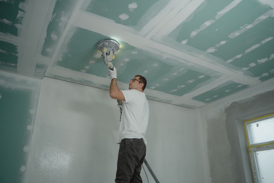 Repaired and blended plaster patch on a living room wall